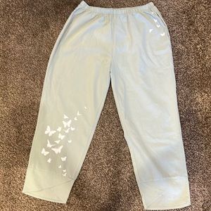 Light sage green capris pants w/butterflies on 1 leg and on 1 side of the waist.